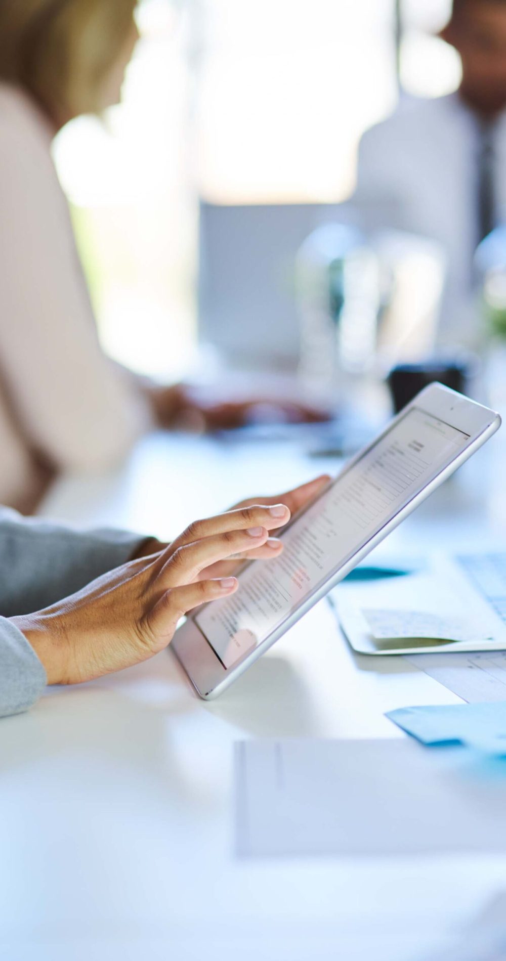 Taking notes in the meeting.